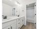 Bathroom boasting double vanity, white cabinets, and a separate room for the toilet and shower at 4046 N Irvington St, Aurora, CO 80019