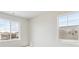 Comfortable bedroom filled with light from large windows, providing serene neighborhood views at 4046 N Irvington St, Aurora, CO 80019