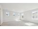 Spacious bedroom with abundant natural light from multiple windows and neutral carpeting at 4046 N Irvington St, Aurora, CO 80019