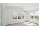 Bright dining room with large windows and modern light fixtures offering great outdoor views at 4046 N Irvington St, Aurora, CO 80019