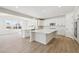 Open concept kitchen with a spacious island, stainless appliances, and ample counter space at 4046 N Irvington St, Aurora, CO 80019