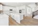 Modern kitchen boasts a large center island, stylish countertops, and sleek white cabinets at 4046 N Irvington St, Aurora, CO 80019