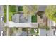 Aerial view of property featuring well-maintained backyard, patio area, detached garage, and mature landscaping at 1960 S Franklin St, Denver, CO 80210