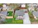 Aerial view of craftsman style home showcasing front porch, well-manicured lawn, and long driveway leading to a detached garage at 1960 S Franklin St, Denver, CO 80210