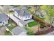 Aerial view of property showcasing updated exterior, detached garage, fenced backyard, and patio perfect for outdoor entertaining at 1960 S Franklin St, Denver, CO 80210