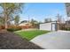 Spacious backyard featuring a detached garage and a well-maintained lawn area at 1960 S Franklin St, Denver, CO 80210