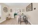 Open-concept dining area features a trendy table and seamlessly connects to the living room for easy entertaining at 1960 S Franklin St, Denver, CO 80210