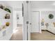 Finished basement hallway with a bedroom and decorated shelves showcases the basement's style and functionality at 1960 S Franklin St, Denver, CO 80210