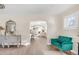 Bright and airy living room offers hardwood floors and seamless transition to the kitchen through an arched opening at 1960 S Franklin St, Denver, CO 80210