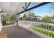 Inviting front porch with a classic white railing offering a beautiful view of the neighborhood at 1960 S Franklin St, Denver, CO 80210