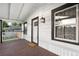 Inviting front porch with a classic white railing, and a wooden floor at 1960 S Franklin St, Denver, CO 80210