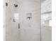 Elegant tiled shower with a glass door, modern fixtures, and a built-in niche for toiletries at 1960 S Franklin St, Denver, CO 80210