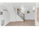 Open staircase with wood railing leading to the upper level of the home at 1960 S Franklin St, Denver, CO 80210