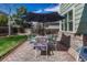 Outdoor patio area with umbrella and patio table and seating with well-manicured backyard at 16361 Parkside Dr, Parker, CO 80134