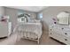 Bright bedroom with large window, white furniture, and neutral carpeting at 16361 Parkside Dr, Parker, CO 80134