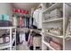 Organized walk-in closet with ample shelving, hanging space, and room for accessories at 16361 Parkside Dr, Parker, CO 80134