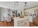 Bright eat-in kitchen with white cabinetry, stainless steel appliances, and a dining table at 16361 Parkside Dr, Parker, CO 80134