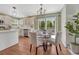 This eat-in kitchen features stainless appliances, lots of natural light, and hardwood flooring at 16361 Parkside Dr, Parker, CO 80134