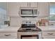 Kitchen features white countertops, tile backsplash, and stainless steel appliances at 16361 Parkside Dr, Parker, CO 80134