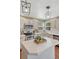 Updated kitchen with white cabinets, stainless steel appliances, and center island at 16361 Parkside Dr, Parker, CO 80134