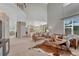 Open-concept living space with high ceilings and seamless flow into the eat-in kitchen at 16361 Parkside Dr, Parker, CO 80134