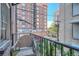 Cozy balcony with wrought iron railing and city views, perfect for relaxing outdoors at 963 N Logan St # 11, Denver, CO 80203