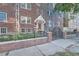 Beautiful brick building with a secure gated entrance and well-maintained landscaping at 963 N Logan St # 11, Denver, CO 80203