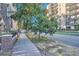 Charming tree lined street view showcasing vintage apartment buildings along tree-lined sidewalks at 963 N Logan St # 11, Denver, CO 80203