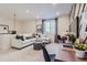 Inviting living room with a sectional sofa, modern decor, and bright natural light. Includes desk and chair at 14152 Bunny Hop Ln, Parker, CO 80134
