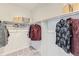 Well-organized walk-in closet with shelving, hanging rods, and ample space for storage at 14152 Bunny Hop Ln, Parker, CO 80134