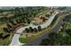 An aerial view of a luxurious community boasting beautifully landscaped homes with lush greenery and tree-lined streets at 11160 Dolce Vita Pl, Littleton, CO 80125