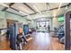 Spacious gym with cardio machines, weight machines, and wood floor at 11160 Dolce Vita Pl, Littleton, CO 80125