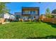 Landscaped backyard with a view of the home's exterior at 3485 S Clermont St, Denver, CO 80222