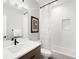 Modern bathroom with white subway tiles, a bathtub, and a vanity at 3485 S Clermont St, Denver, CO 80222