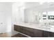 Elegant bathroom with double sinks, large mirror, and modern cabinetry at 3485 S Clermont St, Denver, CO 80222