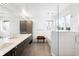 Spa-like bathroom with double vanity, soaking tub, and glass shower at 3485 S Clermont St, Denver, CO 80222