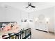 Spacious bedroom with white dresser and corner window at 3485 S Clermont St, Denver, CO 80222