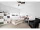 Cozy bedroom with a twin bed, chair, and built-in shelving at 3485 S Clermont St, Denver, CO 80222