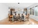 Modern dining area with long wooden table and leather chairs at 3485 S Clermont St, Denver, CO 80222