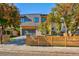 Modern two-story home with wood fence and attached garage at 3485 S Clermont St, Denver, CO 80222