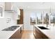 Modern kitchen with stainless steel appliances and white cabinets at 3485 S Clermont St, Denver, CO 80222