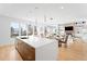 Open concept kitchen with island and view into living area at 3485 S Clermont St, Denver, CO 80222