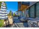 Covered patio with outdoor furniture and room for grilling at 3485 S Clermont St, Denver, CO 80222