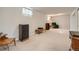 Finished basement featuring carpet, a plush armchair, and a side table with lamps at 12235 E Kentucky Ave, Aurora, CO 80012