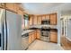 Updated kitchen featuring stainless steel appliances and tiled floor at 12235 E Kentucky Ave, Aurora, CO 80012