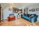 Inviting living room with stylish furniture and view into the kitchen at 12235 E Kentucky Ave, Aurora, CO 80012