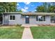 Newly remodeled home with landscaping and walkway at 3100 Gray St, Denver, CO 80214