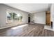 Living room with hardwood floors, fireplace and view of street at 3100 Gray St, Denver, CO 80214