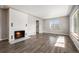 Bright living room with fireplace and wood-look floors at 3100 Gray St, Denver, CO 80214