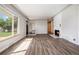 Bright living room features hardwood floors, a fireplace, and large windows at 3100 Gray St, Denver, CO 80214